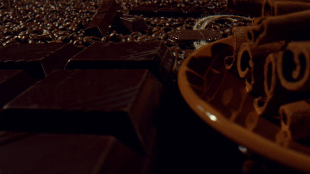 istock Composition of cinnamon sticks. dark chocolate bar and coffee beans 1457617712