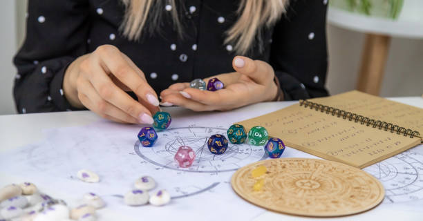 Woman numerologist astrologer counts numbers. Selective focus.