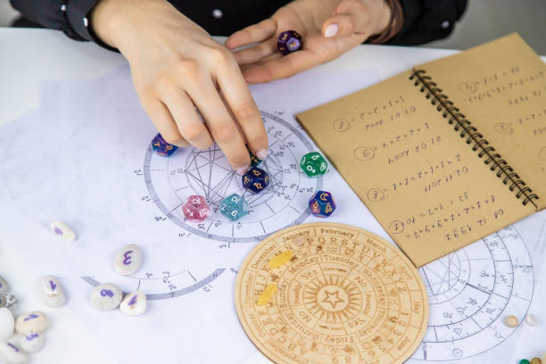 istock Woman numerologist astrologer counts numbers. Selective focus. 1457619613