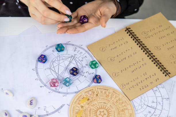istock Woman numerologist astrologer counts numbers. Selective focus. 1457619619