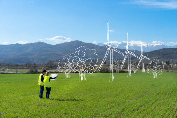 istock Engineers imagine a wind farm in large agricultural field 1457623819