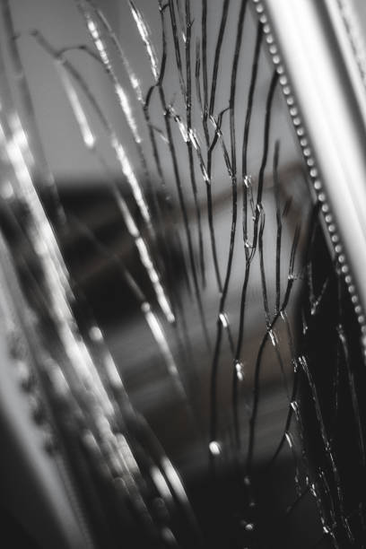 A man reflection on the broken mirror.