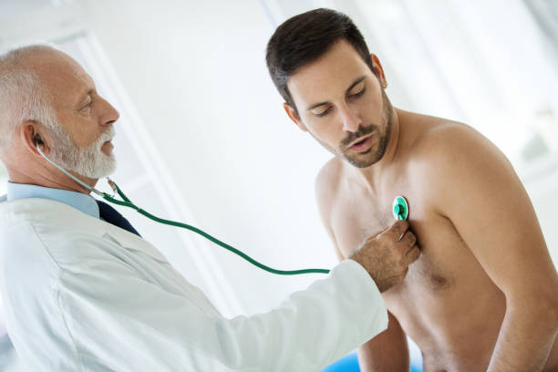 istock Young man having medical check-up 1457631128