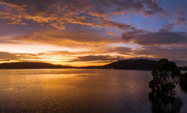 istock After the rain sunrise waterscape with clouds 1457631159