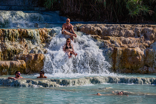 Manciano,Tuscany, Italy -17 June  2022: Mill Falls Hot spring and open air Thermal BathsIn the municipality of Manciano, just a few kilometres from Saturnia, springs of sulphuric waters form large ponds with a temperature of 37.5°