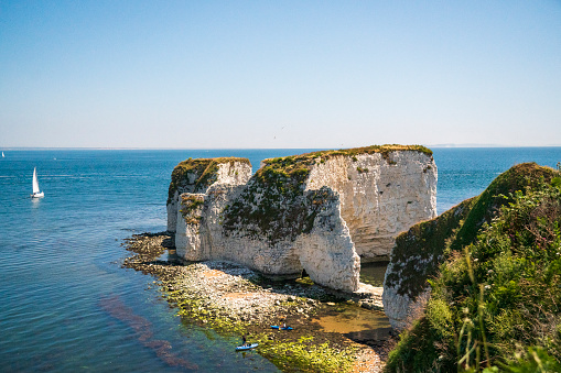 Old Harry Rocks are three chalk formations, including a stack and a stump, located at Handfast Point, on the Isle of Purbeck in Dorset