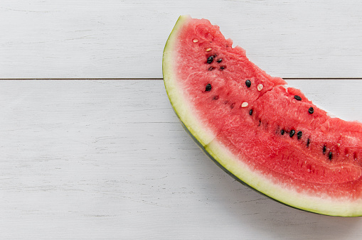 Watermelon sliced on wooden background