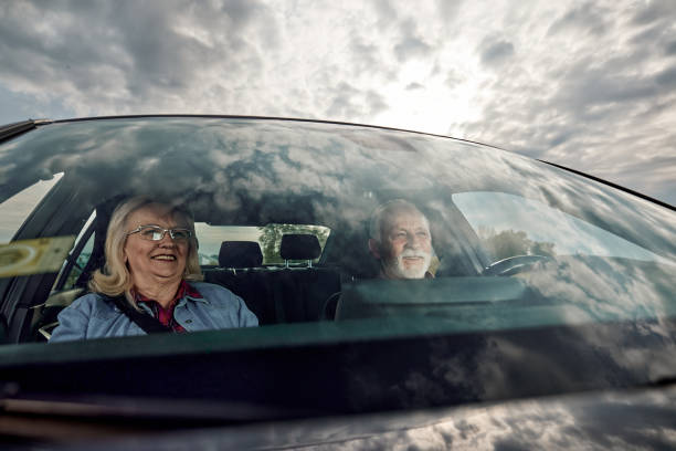 istock Happy mature couple going on a road trip by car. 1457641625