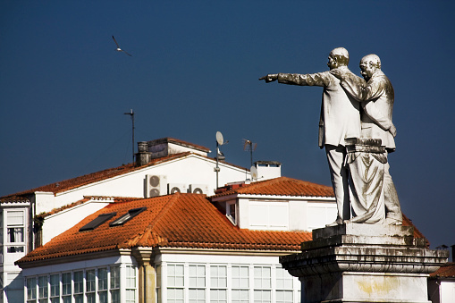 Betanzos, Spain_February 6, 2011: Statue of García Naveira brothers, Betanzos, Coruña, Galicia, Spain. 2 Spanish philanthropists founders of many charities in the early twentieth century.