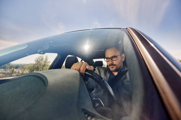 istock Male entrepreneur going on business trip by car. 1457641905