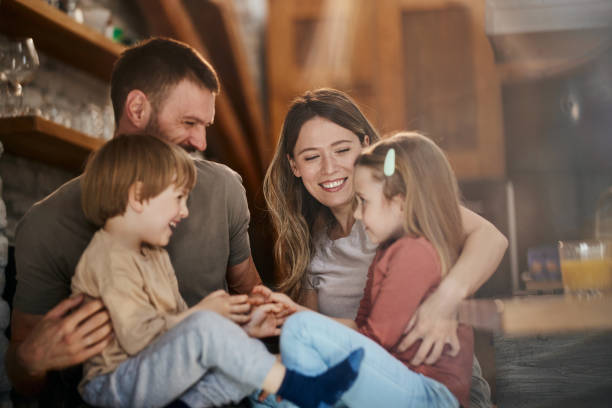 istock Cheerful family having fun while talking at home. 1457642679