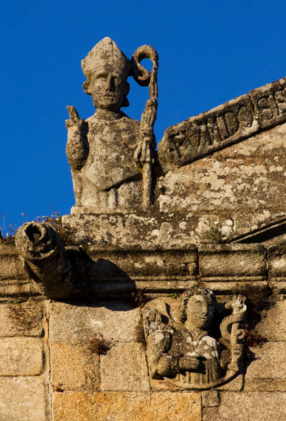 istock Sculpture of bishop ancient catholic church. 1457643471