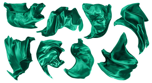 istock Set with beautiful delicate green silk floating on white background 1457645724