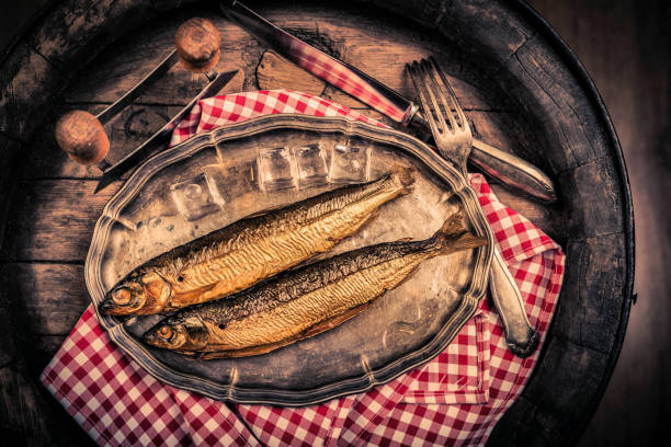 Smoked fish in a traditional way on a rustic background