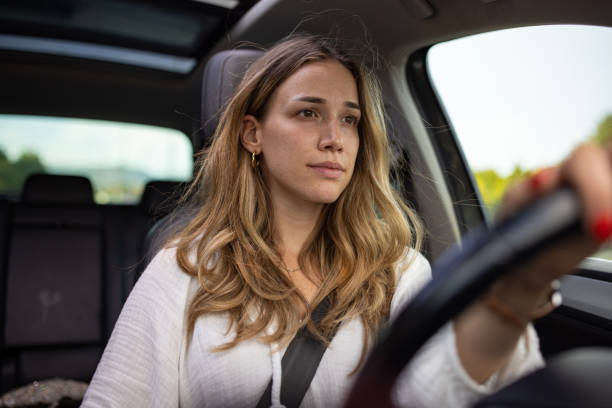 istock Beautiful woman driving 1457646189