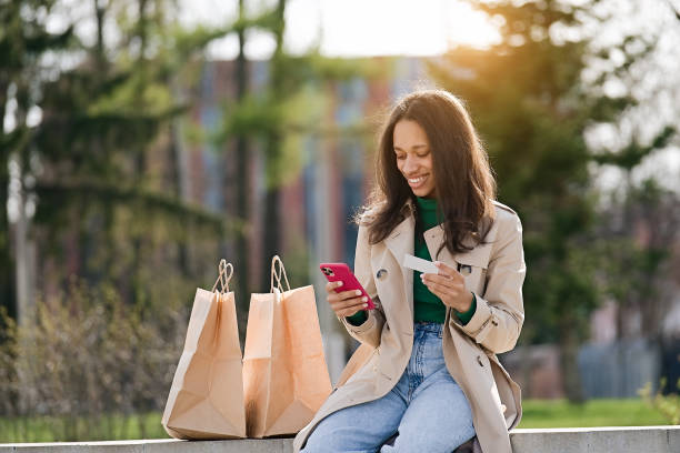 istock Woman  using cell phone for online shopping 1457646227
