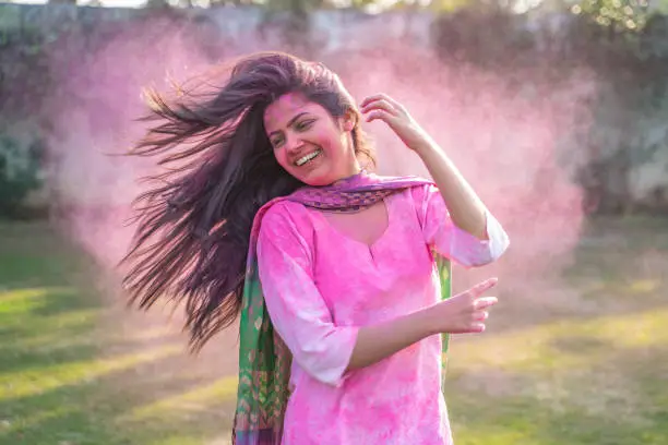 Photo of Indian girl enjoying Holi festival