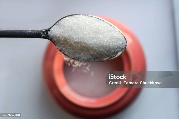 Pour Sugar From A Spoon Stock Photo - Download Image Now - Sugar - Food, Glucose, Teaspoon