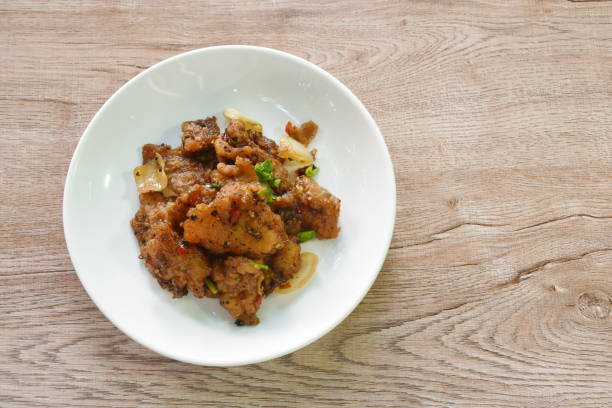 istock fried slice bass fish with onion in black pepper sauce 1457654708