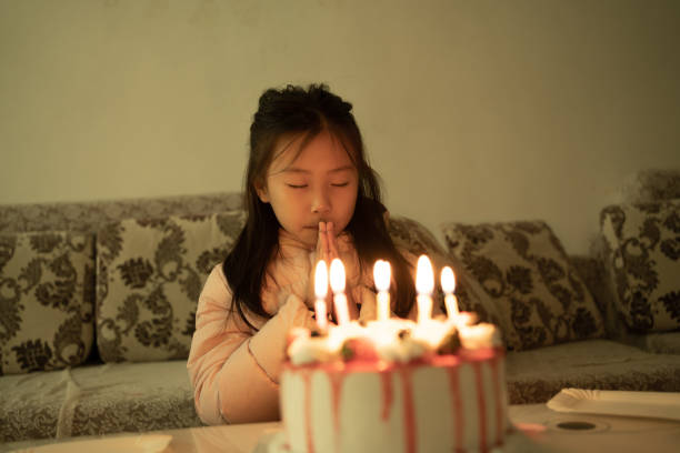 istock birthday wishing girl 1457656907
