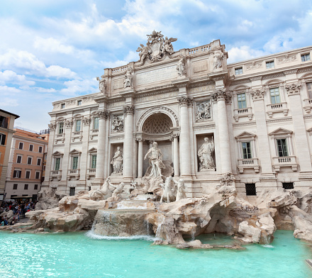 Female contemplating the Trevi fountain in Rome, Italy \nPeople travel enjoying capital cities of Europe concept