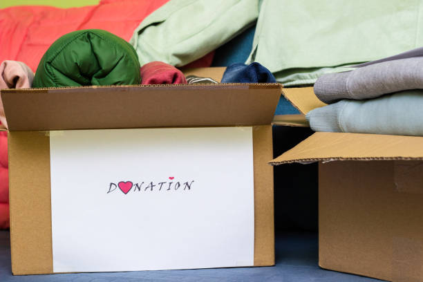 Clothes Donation. Box of warm cloth with donate label