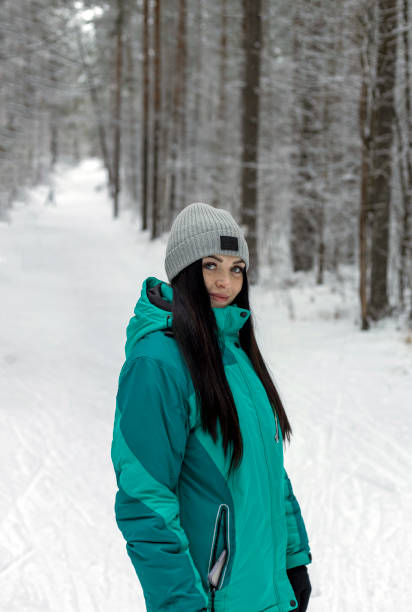 istock Beautiful young woman in winter forest. 1457664861