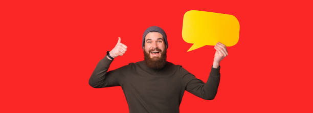 istock Excited man with speech bubble showing thumb up 1457667341