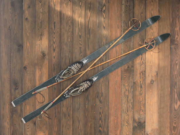 istock alpine skis with ski boots on wooden floor 1457675835