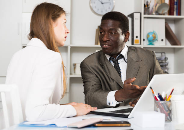 istock Businessman working with female client 1457675905
