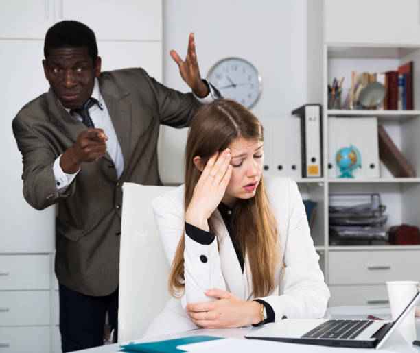 istock Upset woman with angry boss 1457675920