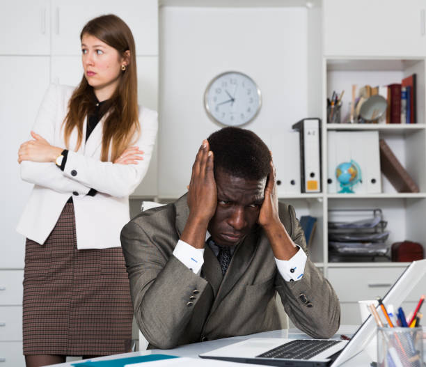 istock Frustrated man after quarrel in office 1457675953
