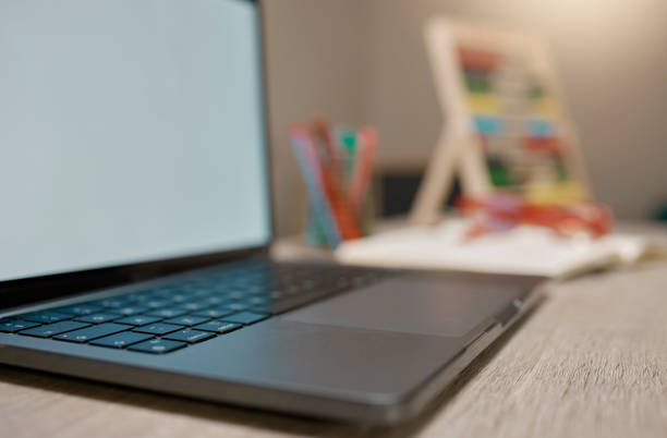istock Laptop screen, online and mockup space, elearning and logo branding on table for homeschool, homework and study. Pc, technology and e learning, education and abacus toy on desk in room with zoom 1457676484