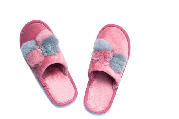istock Home female pink and grey slippers on a white background. 1457678821
