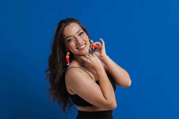 Woman smiling at Brazilian carnival Celebrating the traditional carnival in Brazil carnival stock pictures, royalty-free photos & images