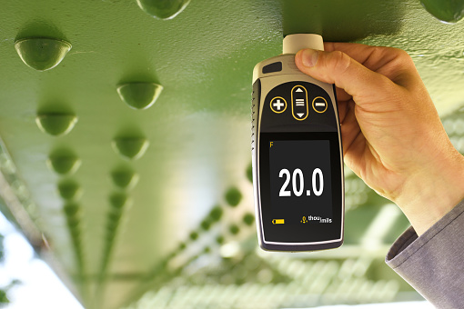 Using the PosiTector 6000 to measure paint thickness on a bridge