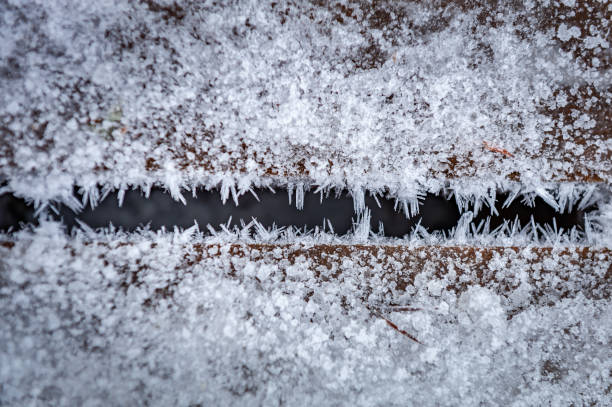 istock Wooden path covered crystals of ice. Frost on boards. 1457682221