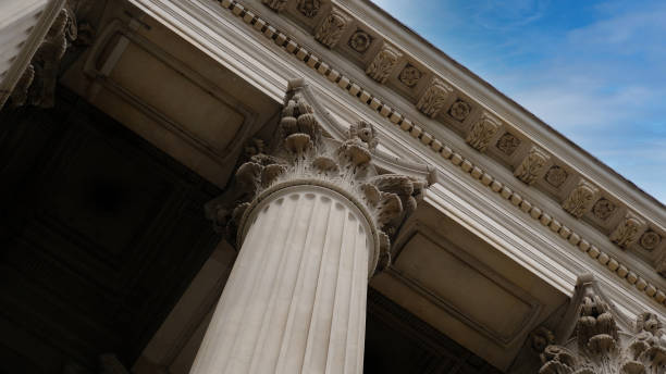 istock Classic architectural column. Details of architecture of historical construction. Element of exterior building with columns and Stucco molding on ceiling of architectural structure in London, UK. 1457684660