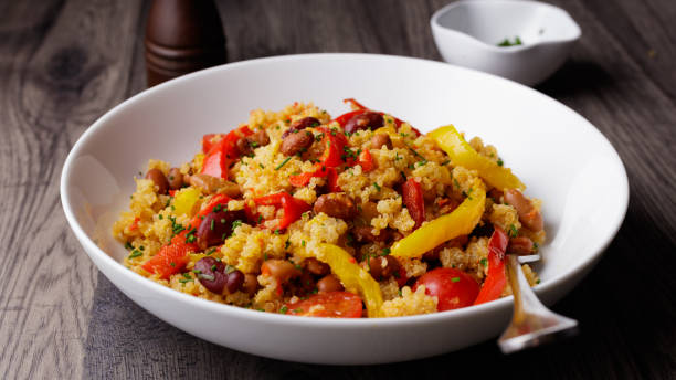 homemade vegan roasted pepper and beans, quinoa salad with fine chopped chives for the garnish