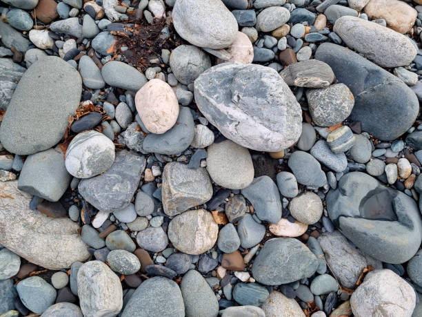 istock water-sharpened stones on the bank of a mountain river. 1457689257