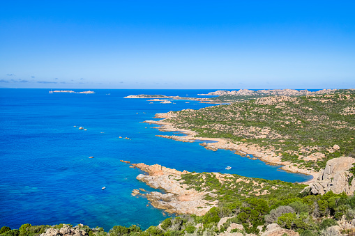 Granite coastline lapped by turquoise colored waters in the northwest of La Maddalena