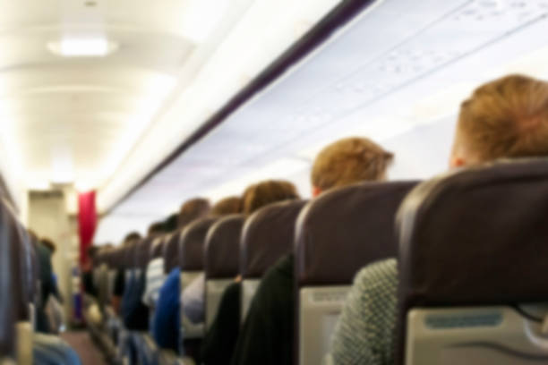 Blur background of passenger plane cabin stock photo