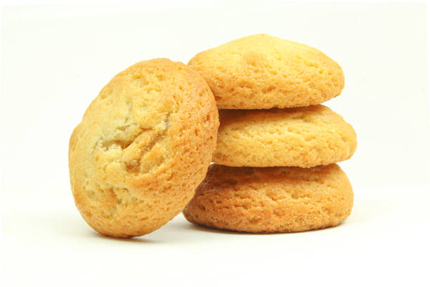 Stack of golden colour biscuits isolated on white background