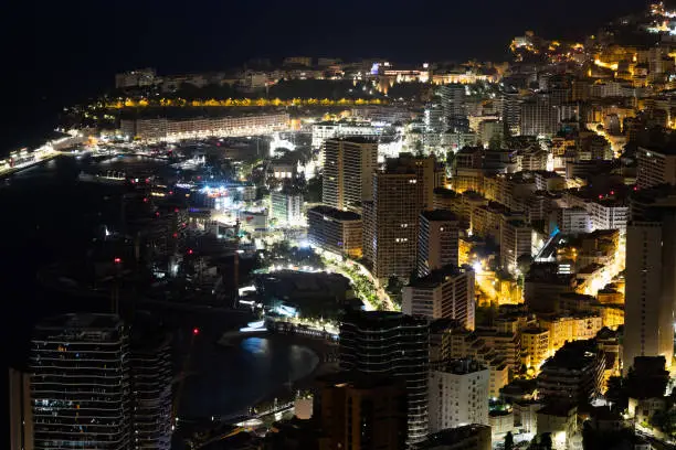 Photo of Monte Carlo panorama illuminated by night. Urban landscape with luxury architecture.