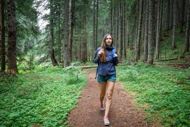 Free Stock Photo of Woman Walking in the Woods With a Backpack ...