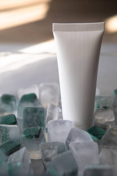 istock Cosmetic product packaging on menthol ice cubes. Mockup. 1457698304