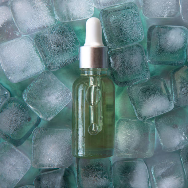 istock Cosmetic product packaging on menthol ice cubes. Mockup. 1457698346