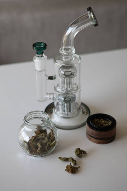 istock Clear glass bong. Smoking marijuana at home. 1457699415