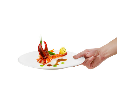 Waiter serving seafood with lobster