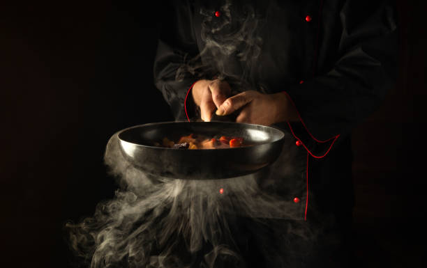istock Molecular gastronomy or cuisine. Chef cooking vegetables in a frying pan. Menu for restaurant or hotel with advertising space 1457700732